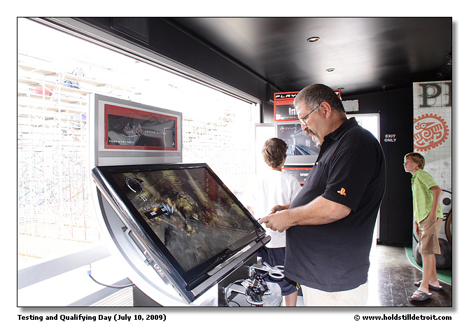 Another visitor trying out a game in the Playstation3 trailer