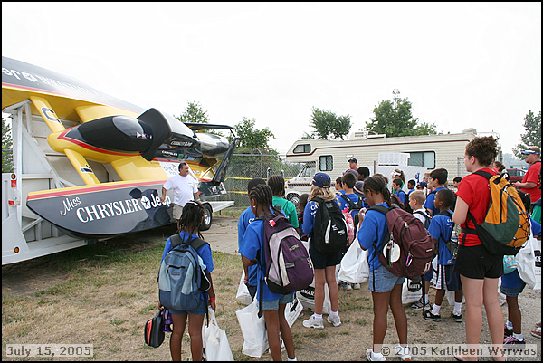 Kids learn about a hydroplane at the display boat